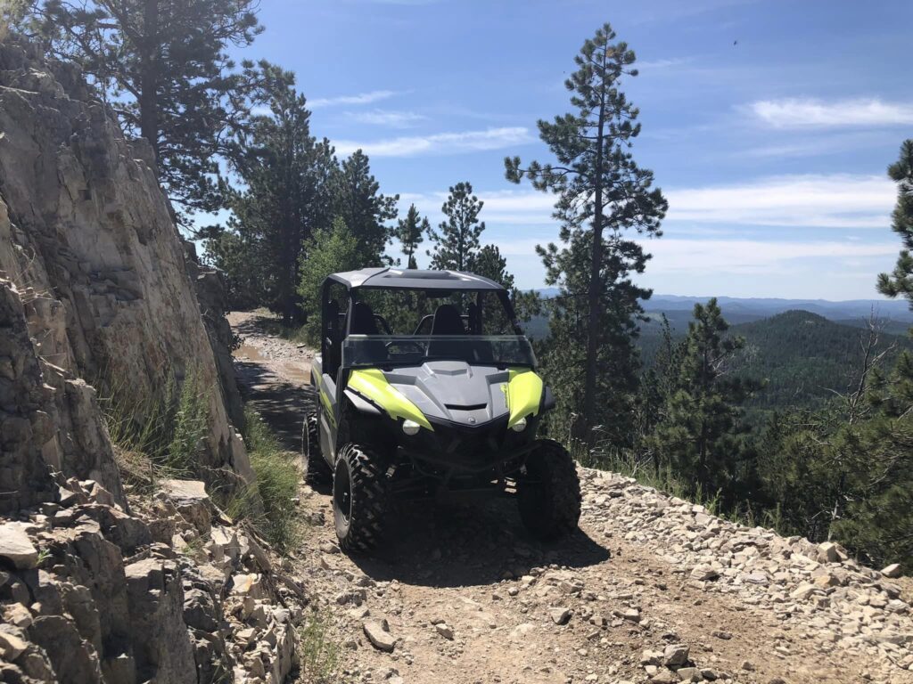 2-seater Yamaha UTV with scenic backdrop of Black Hills