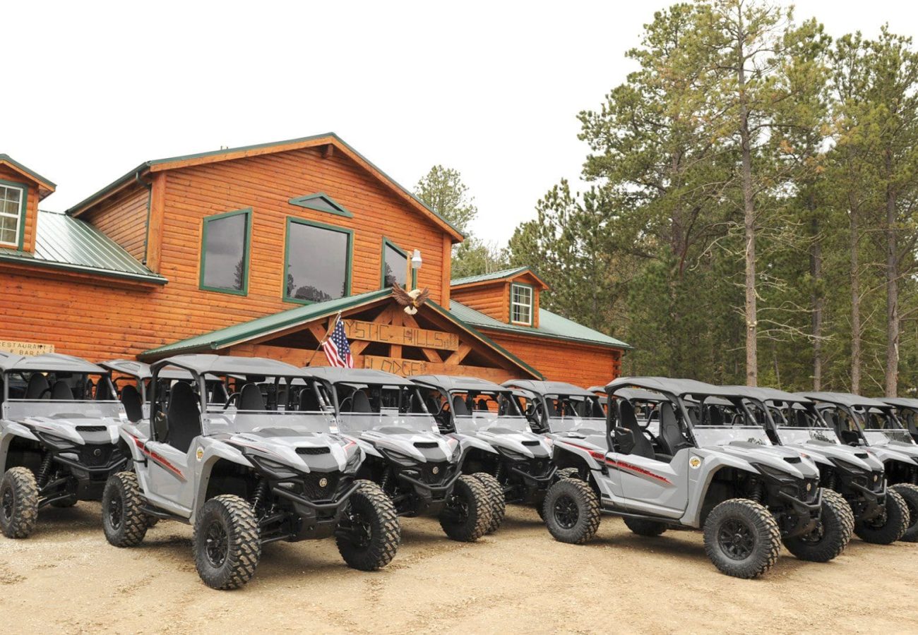 Fleet of UTV's in front of the Mystic Hills Hideaway Campground